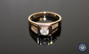 A 14ct yellow gold gent's signet ring, the central brilliant-cut diamond weighing 0.