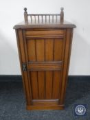 An Edwardian walnut pot cupboard