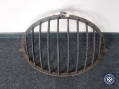 A cast iron hay heck