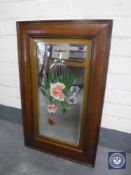 An Edwardian oak framed mirror