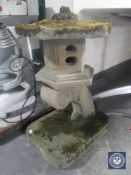 A concrete ornamental garden feature of a Chinese lantern