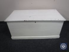 An antique painted pine blanket box