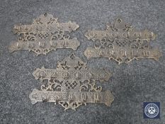 Three cast metal key racks