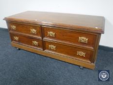 An oak four drawer low cupboard
