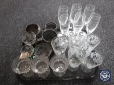 A tray of antique and later etched glasses, miniature Art Nouveau copper planter,