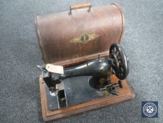 A cased vintage Singer sewing machine