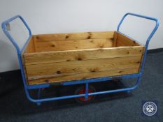 A Slingsby metal and pine storage trolley