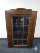 An oak leaded door display cabinet