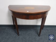 A George III inlaid mahogany demi-lune foldover top card table