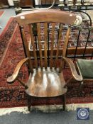 A 19th century pine kitchen armchair,