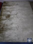 A hand tufted shaggy ivory rug,