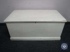 An antique painted pine blanket box