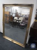 A gilt framed overmantel mirror