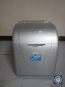 An ice cube machine together with a cash register with key