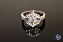 An 18ct white gold sapphire and diamond ring, the central brilliant-cut diamond weighing 0.