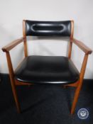 A 20th century teak armchair