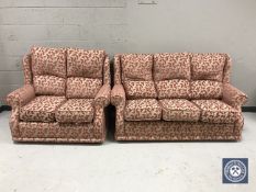 A contemporary three seater settee and two seater settee upholstered in a pink brocade fabric