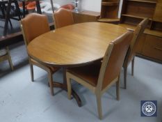 A six-piece 20th century teak dining room suite comprising of oval extending table,