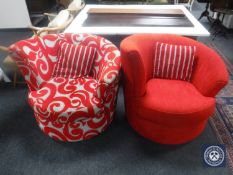 Two contemporary swivel armchairs in a red fabric