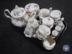 A tray containing twenty-five pieces of Royal Albert Lavender Rose tea china together with a Royal