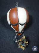 A pottery hot air balloon with basket