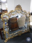 An ornate gilt framed overmantel mirror,