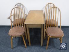 A Priory Oak drop leaf table and four chairs