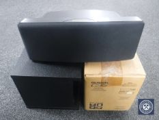 A boxed Celestion Shield speaker together with a Bose Acoustimass 3 speaker