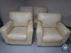 A three-piece cream leather lounge suite together with similar storage footstool