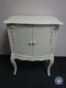A painted double door cabinet