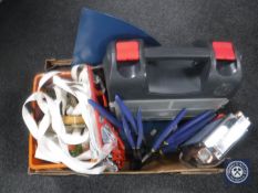 A box containing ratchet straps, tool case, guillotine, clock,