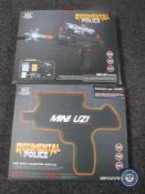 Four boxed Regimental Police mini uzi electric guns