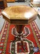 A Regency mahogany octagonal work table on tripod base, height 76 cm.