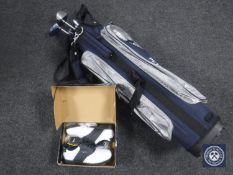 A Petron golf bag containing assorted lady's drivers and irons together with a pair of size 4 1/2