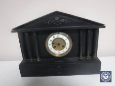 A Victorian black slate mantel clock