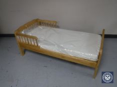 A pine child's bed with Silent Night mattress
