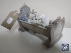 A Lladro figure, Rock a Bye Baby 5717,