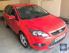 A Ford Focus Zetec 100 five-door hatchback motorcar,red, petrol, 1596 CC, registration NX58 PZB,