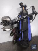 A golf trolley with bag containing Hippo clubs and pair of golf shoes size 8.5.