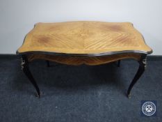 A shaped Kingwood coffee table with gilt metal mounts