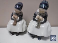 A pair of Royal Copenhagen figures of girls knitting,