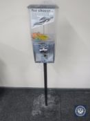 A gumball machine on stand