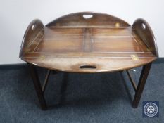 A mahogany butler's tray on stand