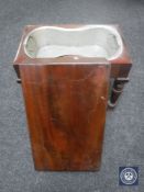 A Victorian baby bath with liner