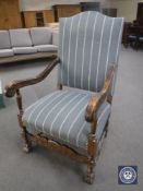 An early 20th century carved oak armchair