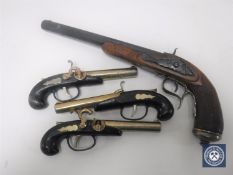 A reproduction flintlock pistol and three further similar small pistols (4)