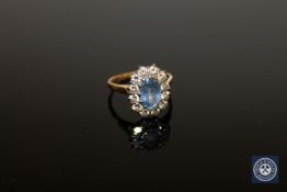 An 18ct gold sapphire and diamond cluster ring,