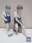 Two Royal Copenhagen figures depicting children by the seaside,