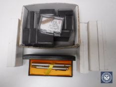 A collection of pen gift sets,