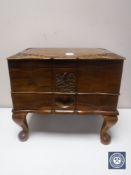 A carved wooden workbox with key together with a Spiderman film cell,